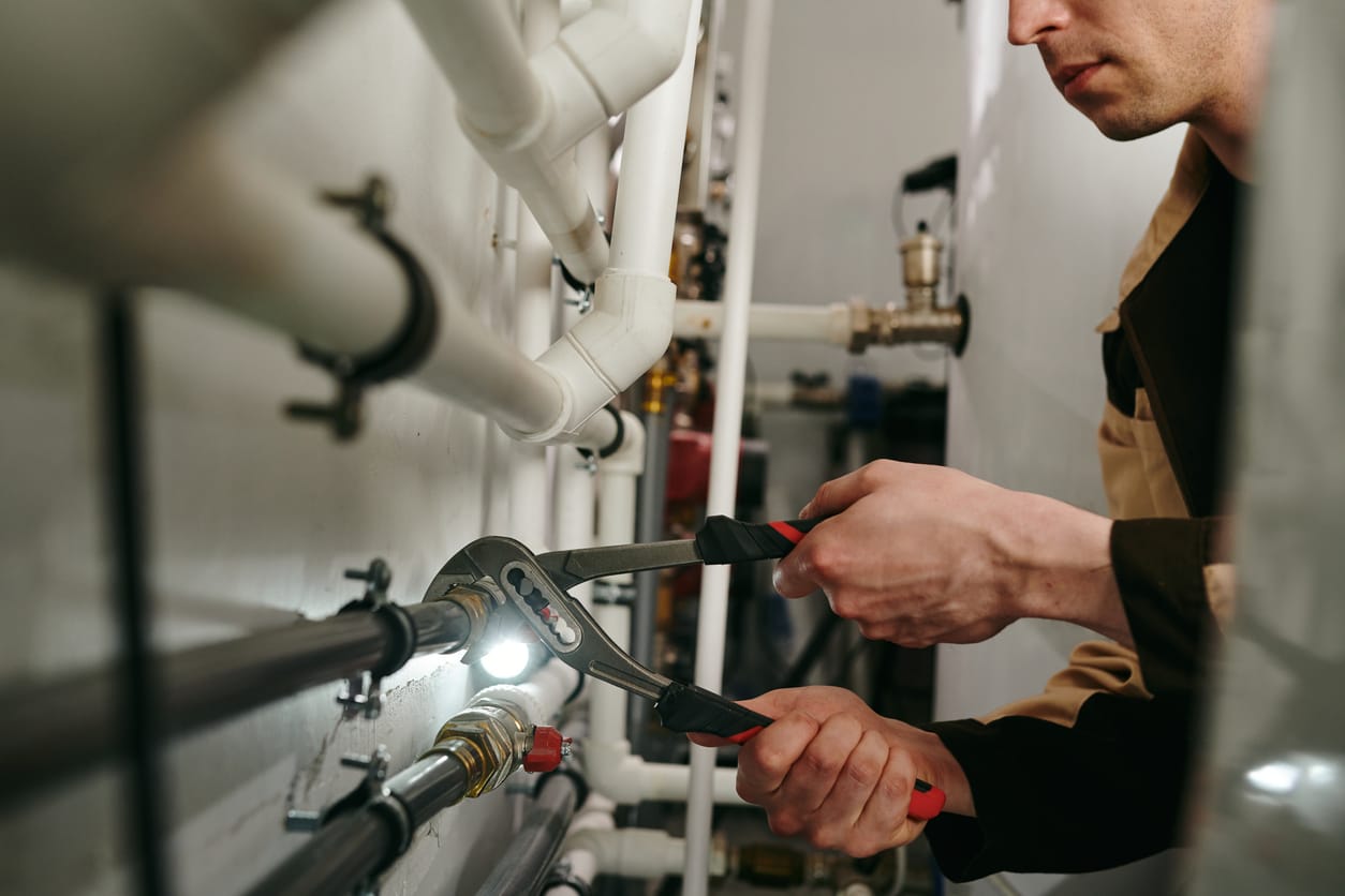 Plumbers maintaining commercial plumbing pipes in Wesley Chapel